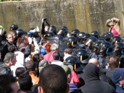 Riot police advancing on a demonstration against the neo-Nazi march